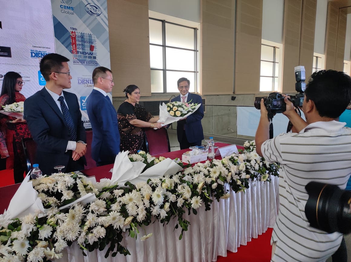 Ms. Mehrul Islam, MD, CEMS Global presenting a bouquet to Shri Sunil Patwari, Chairman, Texprocil at the 19th Dhaka International Yarn & Fabric Show 2023 (19th DIFS 2023) Dhaka, Bangladesh