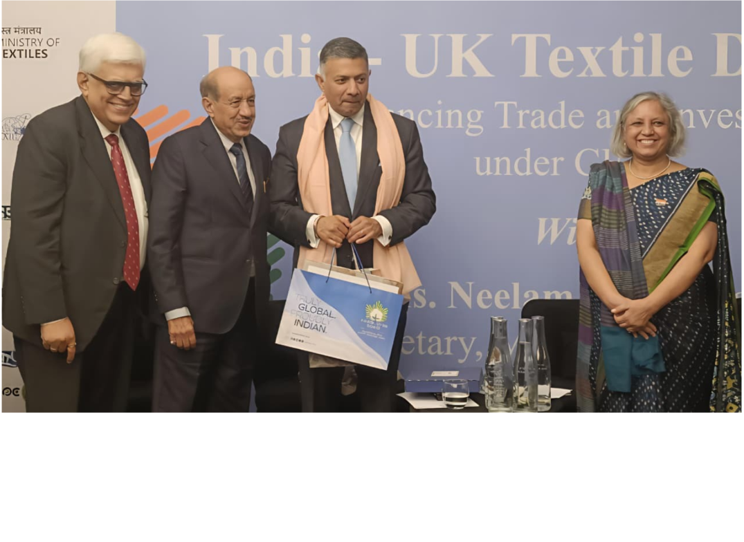 Shri Vijay Agarwal, Chairman, TEXPROCIL felicitating H.E. Vikram Doraiswami, High Commissioner of India to the UK and presenting the Kasturi Cotton hamper in the presence of Secretary, Ministry of Textiles